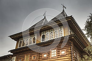 Two towers decorated with weathervanes photo